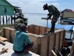 Pembongkaran Papan Mal Tandai Kemajuan Pembangunan Manunggal Air Bersih TMMD Ke-129 di Desa Umbele