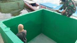 Satgas TMMD Ke-129 Kodim 1311/Morowali Rampungkan Pengecatan Bak Penampungan Air Program Manunggal Air di Desa Umbele