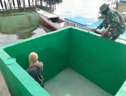 Satgas TMMD Ke-129 Kodim 1311/Morowali Rampungkan Pengecatan Bak Penampungan Air Program Manunggal Air di Desa Umbele