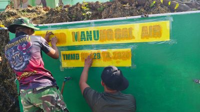 Stiker Program Manunggal Air Bersih Dipasang pada Bak Penampungan Air TMMD ke-129